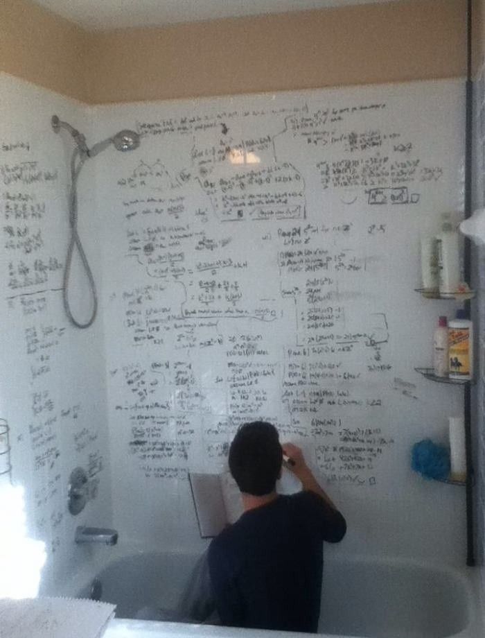 Student actively studying with a whiteboard and recall practice