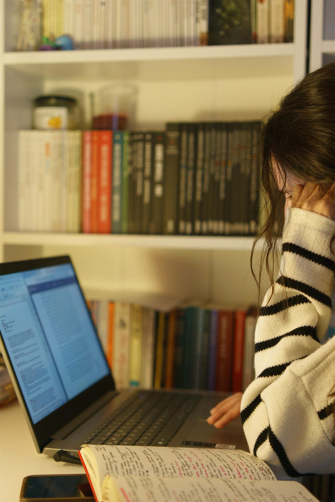 Focused study session at a desk with notebooks
